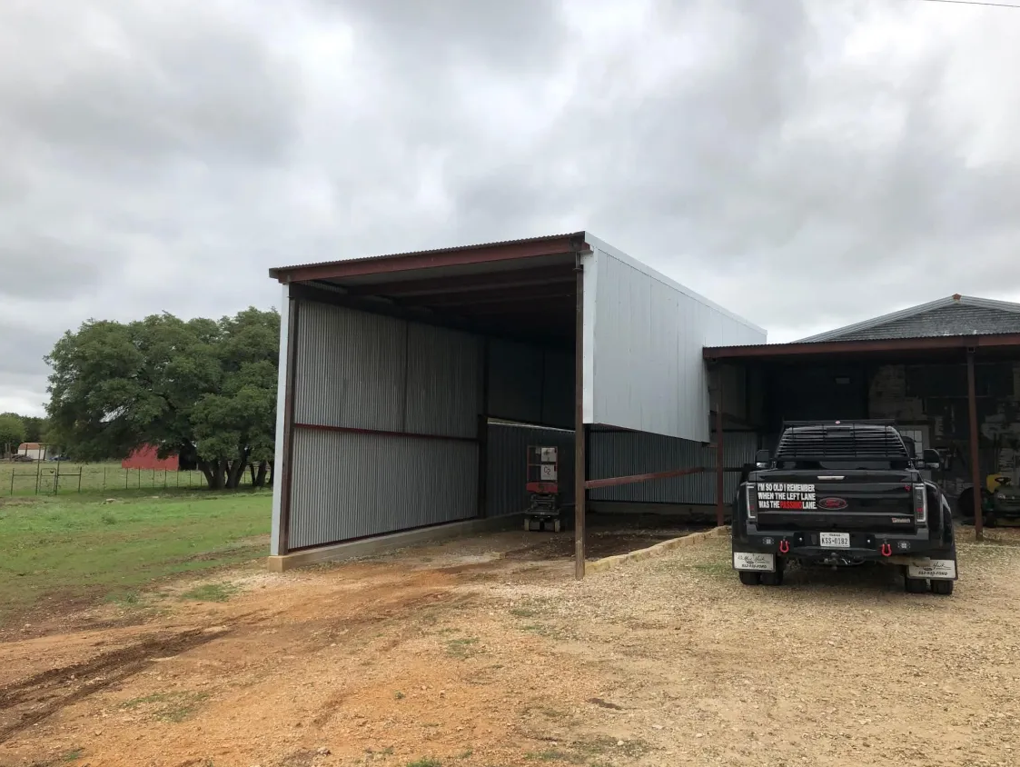 Covered steel structure addition beside an existing building