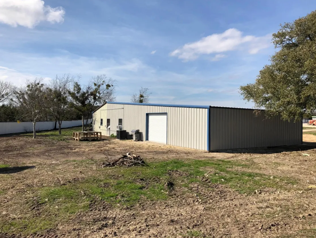 Exterior view of a metal shop building on a concrete foundation